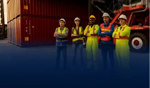 Five logistics workers in high-visibility vests standing in front of shipping containers